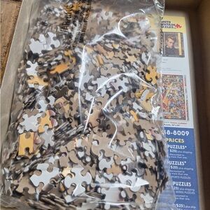 White Mountain Puzzle with Black, White, and Tan Pieces